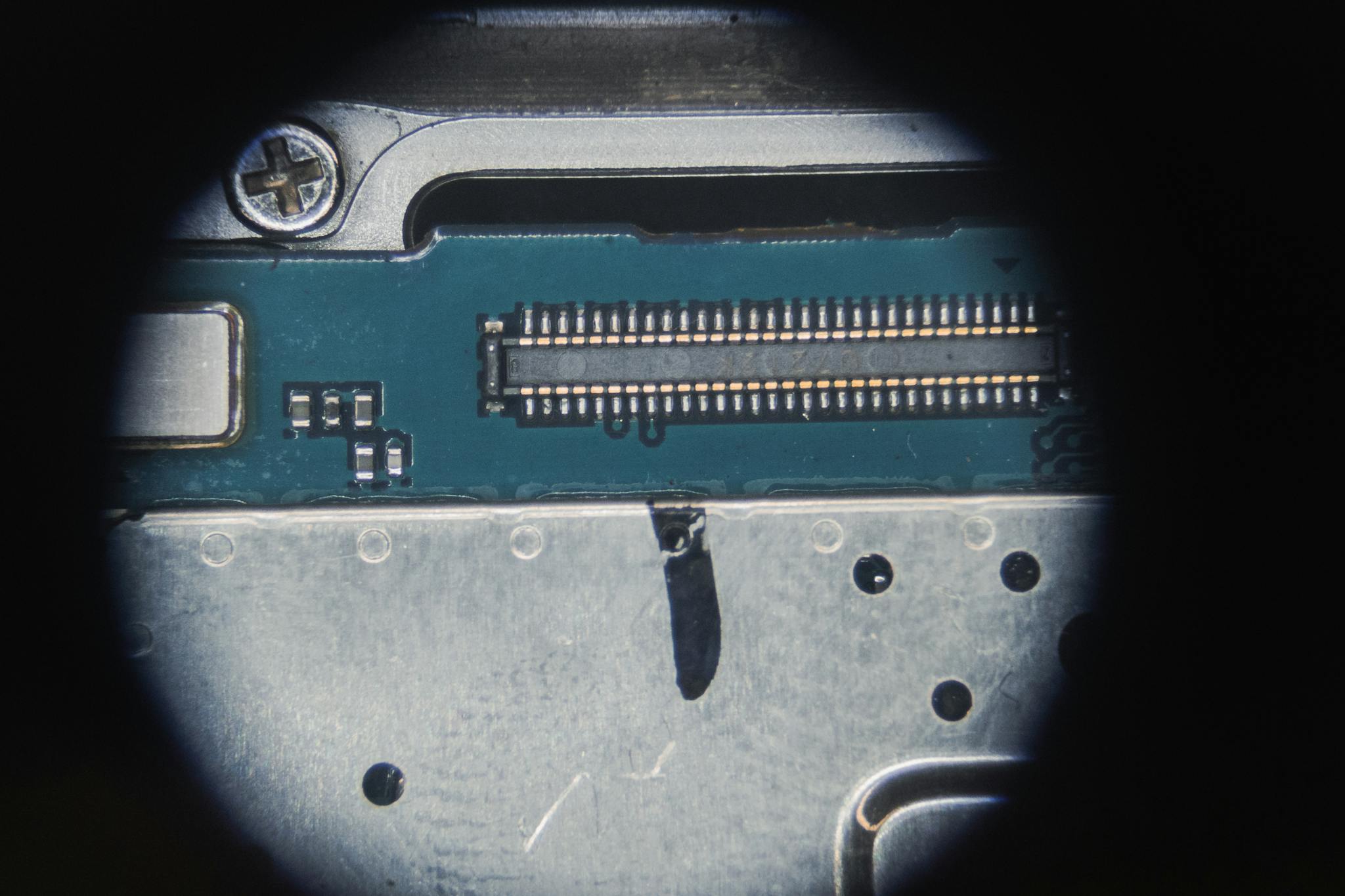 Detailed macro of an electronic circuit board showing micro components and connections.
